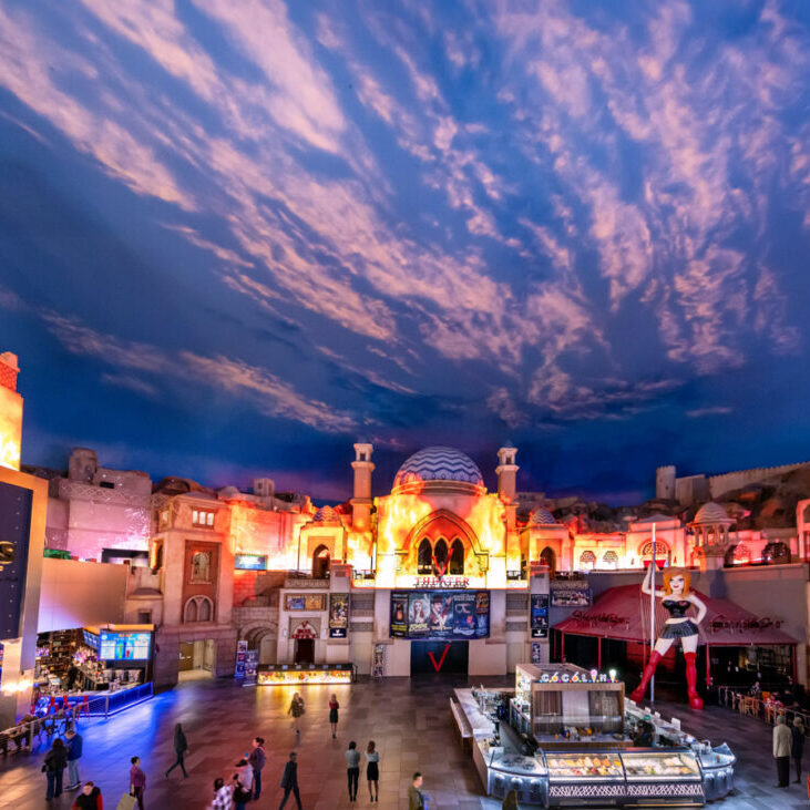 Lost City attraction inside Miracle Mile Shops with illuminated architecture and dramatic sky ceiling.